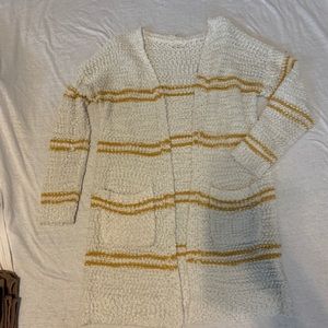white cardigan with yellow stripes